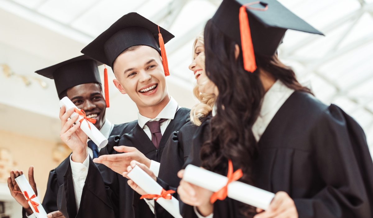 laughing-graduated-multiethnic-students-with-diplomas.jpg
